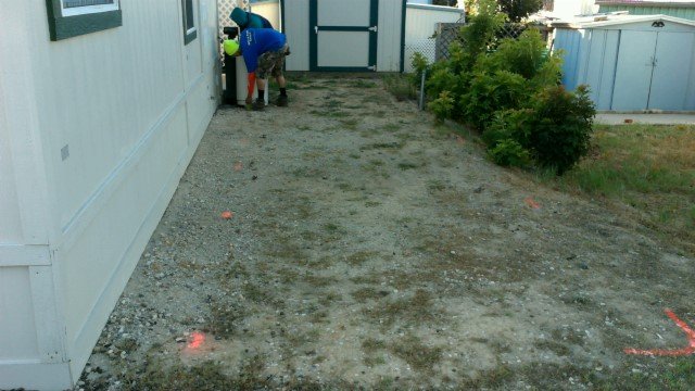 Decorative concrete contractor measuring project area for customer, Las Vegas NV